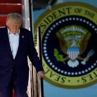 US President Donald Trump walks down the stairs of Air Force One upon his arrival at Joint Base Andrews, Maryland on May 16, 2025. (AP Photo/Luis M. Alvarez)