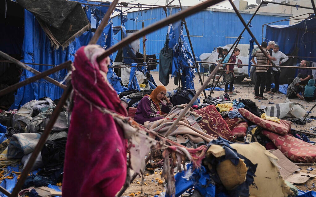 Palestinians inspect the damage caused by an Israeli airstrike that struck tents at Al-Aqsa Hospital in Deir al-Balah, central Gaza Strip, May 17, 2025. (AP Photo/Abdel Kareem Hana)