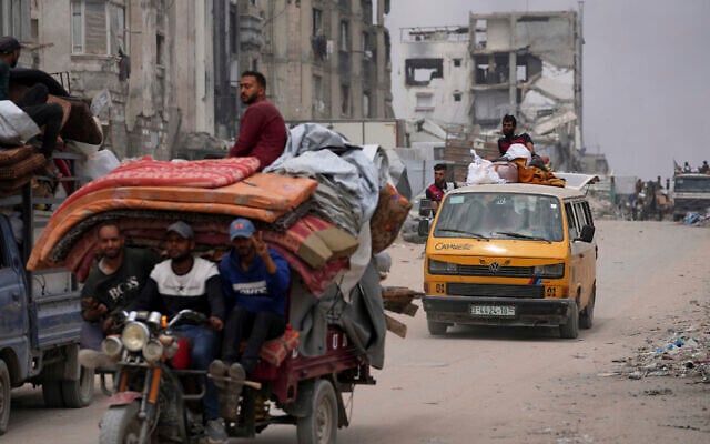 Displaced Palestinians fleeing Beit Lahia amid ongoing Israeli military operations in the Gaza Strip arrive in Jabalia, northern Gaza, on Sunday, May 18, 2025. (AP/Jehad Alshrafi) Displaced Palestinians fleeing Beit Lahia amid ongoing Israeli military operations in the Gaza Strip arrive in Jabalia, northern Gaza, on Sunday, May 18, 2025. (AP/Jehad Alshrafi)