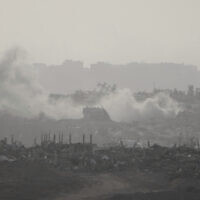 Smoke rises following an Israeli airstrike in the Gaza Strip, seen from southern Israel, May 18, 2025. (AP Photo/Ariel Schalit)