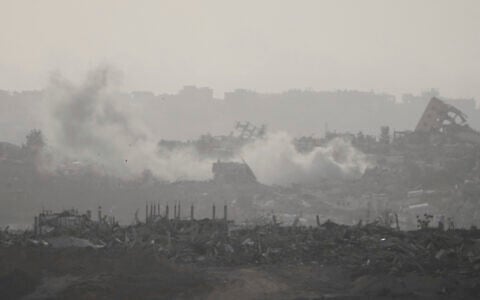 Smoke rises following an Israeli airstrike in the Gaza Strip, seen from southern Israel, May 18, 2025. (AP Photo/Ariel Schalit)