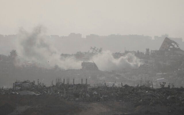 Smoke rises following an Israeli airstrike in the Gaza Strip, seen from southern Israel, May 18, 2025. (AP Photo/Ariel Schalit)