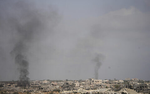Smoke rises following an Israeli army bombardment in Khan Younis, Gaza, as seen from southern Israel, May 19, 2025. (AP Photo/Ohad Zwigenberg)
