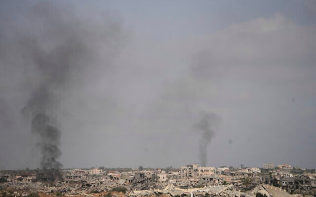 Smoke rises following an Israeli army bombardment in Khan Younis, Gaza, as seen from southern Israel, May 19, 2025. (AP Photo/Ohad Zwigenberg)
