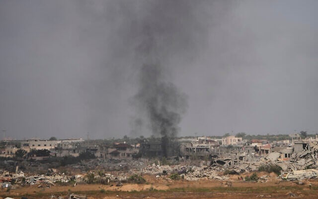 Smoke rises following an Israeli army bombardment in Khan Younis, Gaza, as seen from southern Israel, Monday, May 19, 2025. (AP Photo/Ohad Zwigenberg)
