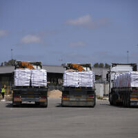 Trucks carrying humanitarian aid for the Gaza Strip are seen at the Kerem Shalom Crossing in southern Israel, May 19, 2025. (AP/ Ohad Zwigenberg)
