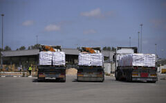 Trucks carrying humanitarian aid for the Gaza Strip are seen at the Kerem Shalom Crossing in southern Israel, May 19, 2025. (AP/Ohad Zwigenberg)