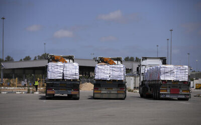 Trucks carrying humanitarian aid for the Gaza Strip are seen at the Kerem Shalom Crossing in southern Israel, May 19, 2025. (AP/ Ohad Zwigenberg)