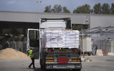 Trucks carrying humanitarian aid for the Gaza Strip are seen at the Kerem Shalom Crossing in southern Israel, Monday, May 19, 2025. (AP/Ohad Zwigenberg)
