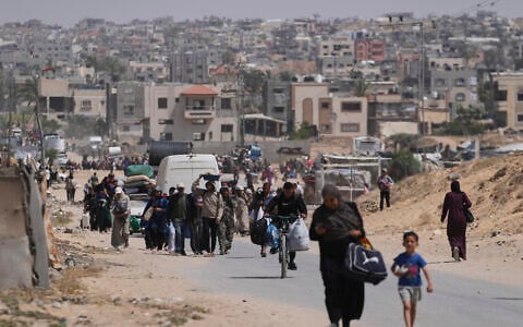 Displaced Palestinians flee from Khan Younis, Gaza, during the ongoing Israeli military offensive in the area, May 19, 2025. (AP Photo/Abdel Kareem Hana)