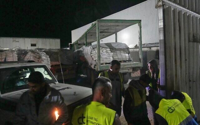 Aid trucks carrying food arrive at a World Food Program warehouse in Az-Zawayda, central Gaza Strip, May 21, 2025. (AP Photo/Abdel Kareem Hana)