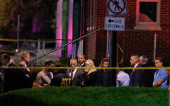 US Attorney General Pam Bondi, center, walks to her car as law enforcement work the scene after two staff members of the Israeli Embassy were shot and killed outside the Capital Jewish Museum, May 22, 2025, in Washington. (AP Photo/Rod Lamkey, Jr.)