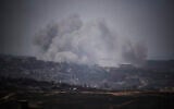 Illustrative: Smoke rises to the sky following an explosion in the northern of Gaza Strip as seen from southern Israel, May 23, 2025. (AP Photo/Leo Correa)