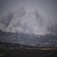 Illustrative: Smoke rises to the sky following an explosion in the northern of Gaza Strip as seen from southern Israel, May 23, 2025. (AP Photo/Leo Correa)