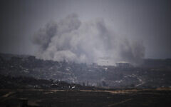 Illustrative: Smoke rises to the sky following an explosion in the northern of Gaza Strip as seen from southern Israel, May 23, 2025. (AP Photo/Leo Correa)