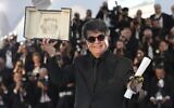 Director Jafar Panahi, winner of the Palme d'Or for the film 'It Was Just an Accident', poses for photographers at the awards ceremony photo call at the 78th international film festival, Cannes, southern France, May 24, 2025. (Natacha Pisarenko/AP)