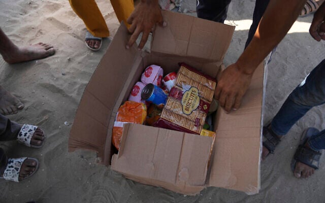 Palestinians open a box containing food and humanitarian aid packages delivered by the Gaza Humanitarian Foundation, a US-backed organization approved by Israel, in Rafah, southern Gaza Strip, on May 27, 2025. (AP Photo/Abdel Kareem Hana) Palestinians open a box containing food and humanitarian aid packages delivered by the Gaza Humanitarian Foundation, a US-backed organization approved by Israel, in Rafah, southern Gaza Strip, on May 27, 2025. (AP Photo/Abdel Kareem Hana)