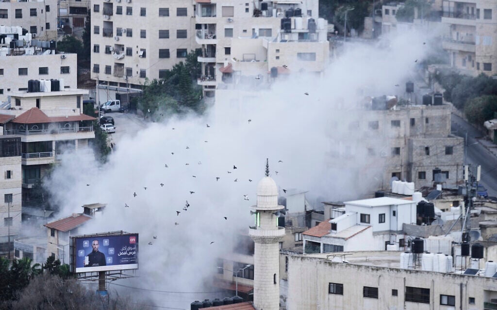 Smoke rises as Israeli forces demolish the home of Jaafar Mona, a Hamas member behind a failed 2024 Tel Aviv suicide bombing, in the West Bank City of Nablus on May 29, 2025. (AP Photo/Majdi Mohammed)