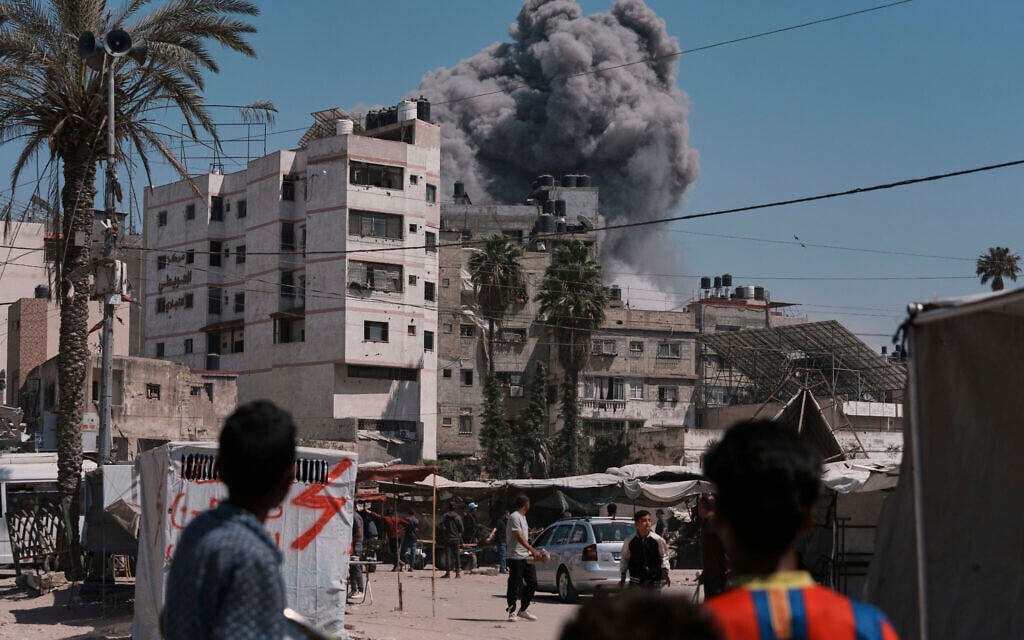 Smoke rises in the sky following an Israeli airstrike in Gaza City, Friday, May 30, 2025. (AP Photo/Jehad Alshrafi)