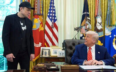 US President Donald Trump (seated) speaks during a news conference with Elon Musk in the Oval Office of the White House, May 30, 2025, in Washington. (AP Photo/Evan Vucci)