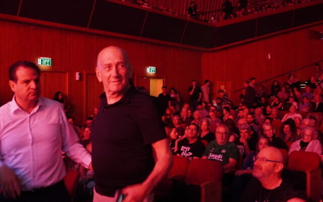 Former prime minister Ehud Olmert and Hadash-Ta'al chairman Ayman Odeh at a peace conference in Jerusalem's International Convention Center on May 9, 2025. (Charlie Summers/Times of Israel)