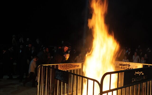 Haredi revelers light a bonfire marking the Lag B'Omer holiday at the tomb of Rabbi Shimon Bar Yochai on Mount Meron on May 15, 2025. (Charlie Summers) Haredi revelers light a bonfire marking the Lag B'Omer holiday at the tomb of Rabbi Shimon Bar Yochai on Mount Meron on May 15, 2025. (Charlie Summers)