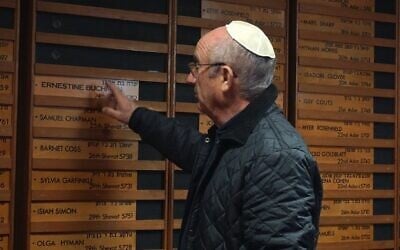 Michael Black of Belfast Hebrew Congregation shows off the synagogue's memorial wall in April 2025. (Rosario Del Valle/ JTA)