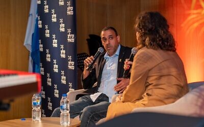Eli Sharabi in conversation with Tzufit Granot at his book launch at ANU - The Museum of the Jewish People in Tel Aviv,  May 30, 2024. (Guy Gueta)