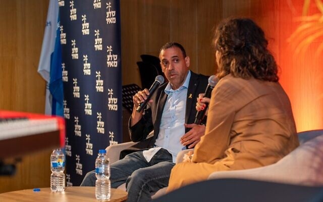 Eli Sharabi in conversation with Tzufit Granot at his book launch at ANU - The Museum of the Jewish People in Tel Aviv,  May 30, 2024. (Guy Gueta)