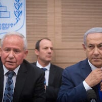 Prime Minister Benjamin Netanyahu (R) and chairman of the Knesset's Foreign Affairs and Defense Committee Avi Dichter attend a committee meeting in Jerusalem, November 19, 2018. (Miriam Alster/Flash90)