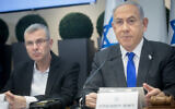 Prime Minister Benjamin Netanyahu and Justice Minister Yariv Levin attend a cabinet meeting at the Kirya military base in Tel Aviv on December 24, 2023. (Miriam Alster/Flash90)