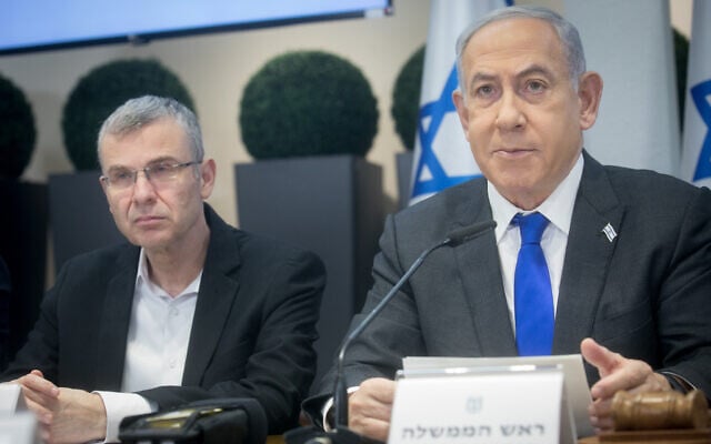 Prime Minister Benjamin Netanyahu and Justice Minister Yariv Levin attend a cabinet meeting at the Kirya military base in Tel Aviv on December 24, 2023. (Miriam Alster/Flash90) Prime Minister Benjamin Netanyahu and Justice Minister Yariv Levin attend a cabinet meeting at the Kirya military base in Tel Aviv on December 24, 2023. (Miriam Alster/Flash90)
