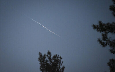 Smoke trails, apparently from the interception of a Houthi missile fired from Yemen, are seen above Kibbutz Baram in northern Israel, May 2, 2025. (Michael Giladi/Flash90)