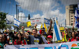 Protesters demonstrate against Prime Minister Benjamin Netanyahu and his government, near the Knesset in Jerusalem, May 5, 2025. The small white sign reads "A government that has forgotten what it is to be a Jew." (Chaim Goldberg/Flash90)