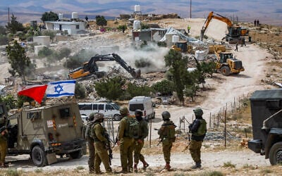 Israeli security forces demolish buildings in Khalet Al-Dab, in the Masafer Yatta area, south of Hebron, in the West Bank, May 5, 2025. (Wisam Hashlamoun/Flash90)