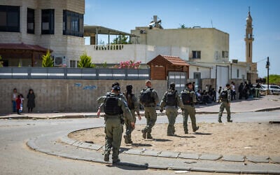 Illustrative: Police carry out a raid in the southern Bedouin town of Rahat, May 7, 2025. (Chaim Goldberg/Flash90) Illustrative: Police carry out a raid in the southern Bedouin town of Rahat, May 7, 2025. (Chaim Goldberg/Flash90)