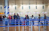 Travelers lining up to check in for flights at Ben Gurion Airport, May 7, 2025. (Nati Shohat/Flash90)