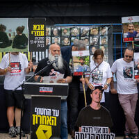 Dani Miran and other families of Israelis held hostage by Hamas in Gaza hold a press conference at Hostages' Square in Tel Aviv, May 12, 2025. (Chaim Goldberg/Flash90)