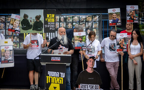Dani Miran and other families of Israelis held hostage by Hamas in Gaza hold a press conference at Hostages' Square in Tel Aviv, May 12, 2025. (Chaim Goldberg/Flash90)
