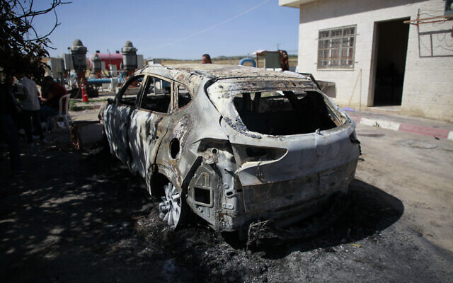 Palestinians examine a burned vehicle set on fire by unknown attackers overnight, in the Masoudiya area, north of the West Bank city of Nablus, May 16, 2025. (Nasser Ishtayeh/Flash90) Palestinians examine a burned vehicle set on fire by unknown attackers overnight, in the Masoudiya area, north of the West Bank city of Nablus, May 16, 2025. (Nasser Ishtayeh/Flash90)