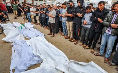 Palestinians mourn the death of people killed in an Israeli airstrike outside the Nasser Hospital in Khan Younis, in the southern Gaza Strip, May 18, 2025. (Abed Rahim Khatib/Flash90)