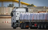 Trucks with loaded with humanitarian aid seen before entering the Gaza Strip, on the Israeli side of the border with Gaza, May 19, 2025. (Flash90)