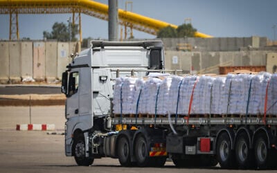 Trucks with loaded with humanitarian aid seen before entering the Gaza Strip, on the Israeli side of the border with Gaza, May 19, 2025. (Flash90)