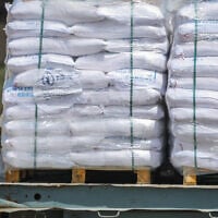 Trucks loaded with humanitarian aid seen on the Israeli side of the border of the Gaza Strip, before entering the territory, May 19, 2025. (Flash90)