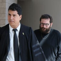 Qatargate suspect Jonatan Urich arrives to a hearing at the Central District Court with his attorney, Amit Hadad, on May 22, 2025. (Jonathan Shaul/Flash90)