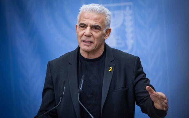Opposition Leader Yair Lapid leads a Yesh Atid faction meeting at the Knesset in Jerusalem, May 26, 2025. (Noam Revkin Fenton/Flash90)
