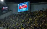 A Home Front Command warning of incoming missile fire appears on a jumbotron during the final of the Israel State Cup between Hapoel Beersheba and Beitar Jerusalem at the Bloomfield Stadium in Tel Aviv, May 29, 2025. (Oren Ben Hakoon/Flash90)