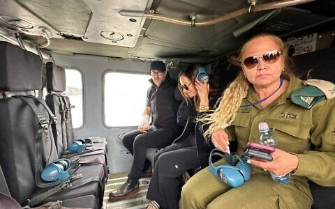 Yael Alexander (center), mother of hostage Edan, and US hostage envoy Adam Boehler (left) board a helicopter en route to southern Israel, ahead of Edan's expected release from Hamas captivity, May 12, 2025 (Courtesy used in accordance with Clause 27a of the Copyright Law)