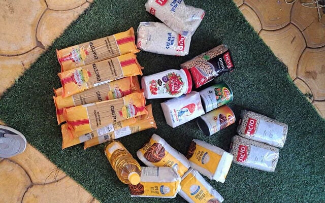 An image posted on X on May 27, 2025, shows aid boxes being distributed to Gazans at new distribution center in Rafah containing bags of rice, pasta, dried beans, flour, oil, salt, tahini and some canned vegetables (X; used in accordance with Clause 27a of the Copyright Law)