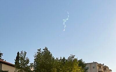 Illustrative: Smoke trails, apparently from the interception of a Houthi missile fired from Yemen, are seen high above Jerusalem, May 2, 2025. (Times of Israel)